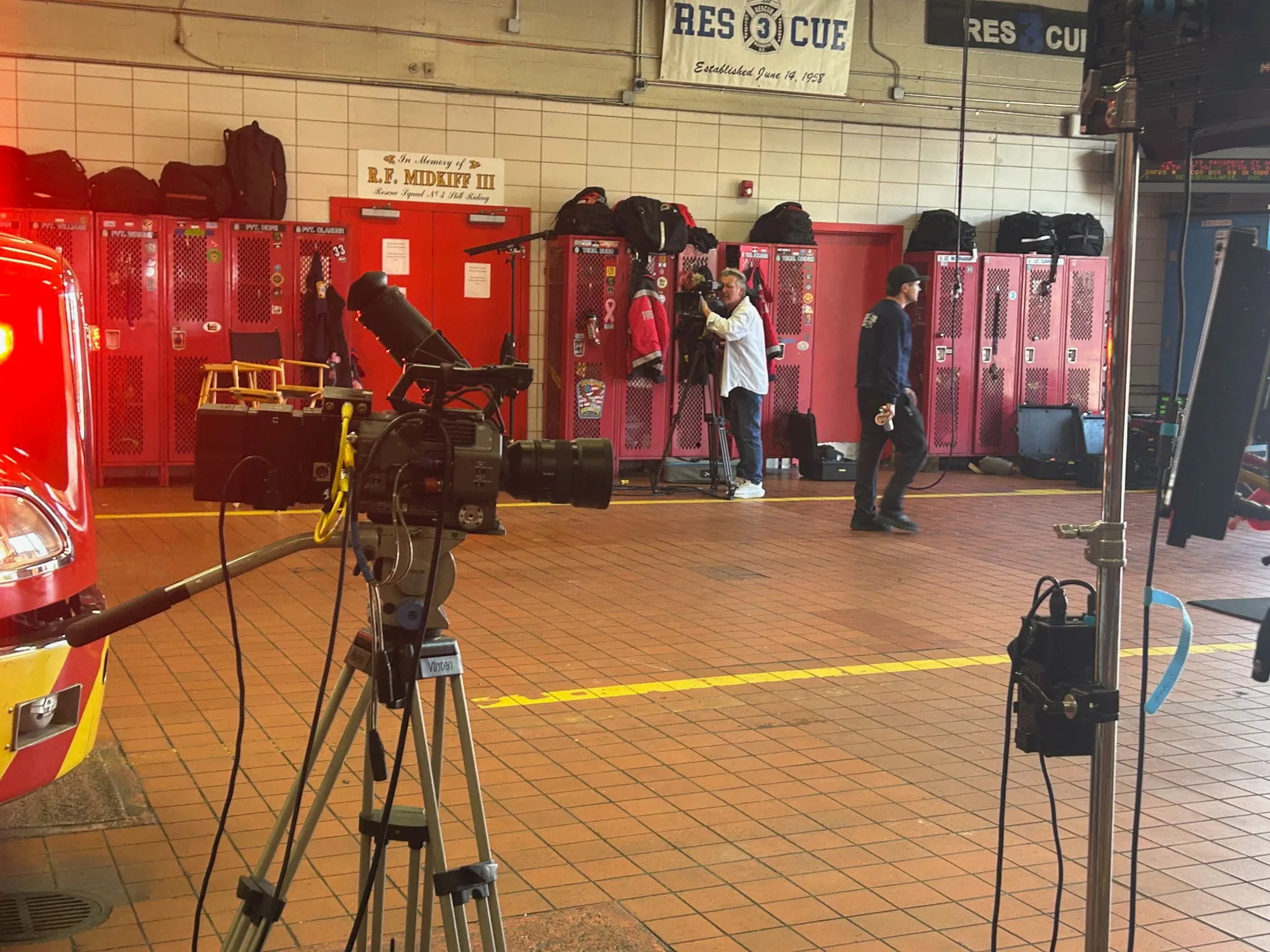 Documentary cameras and lighting set up inside a Washington firehouse