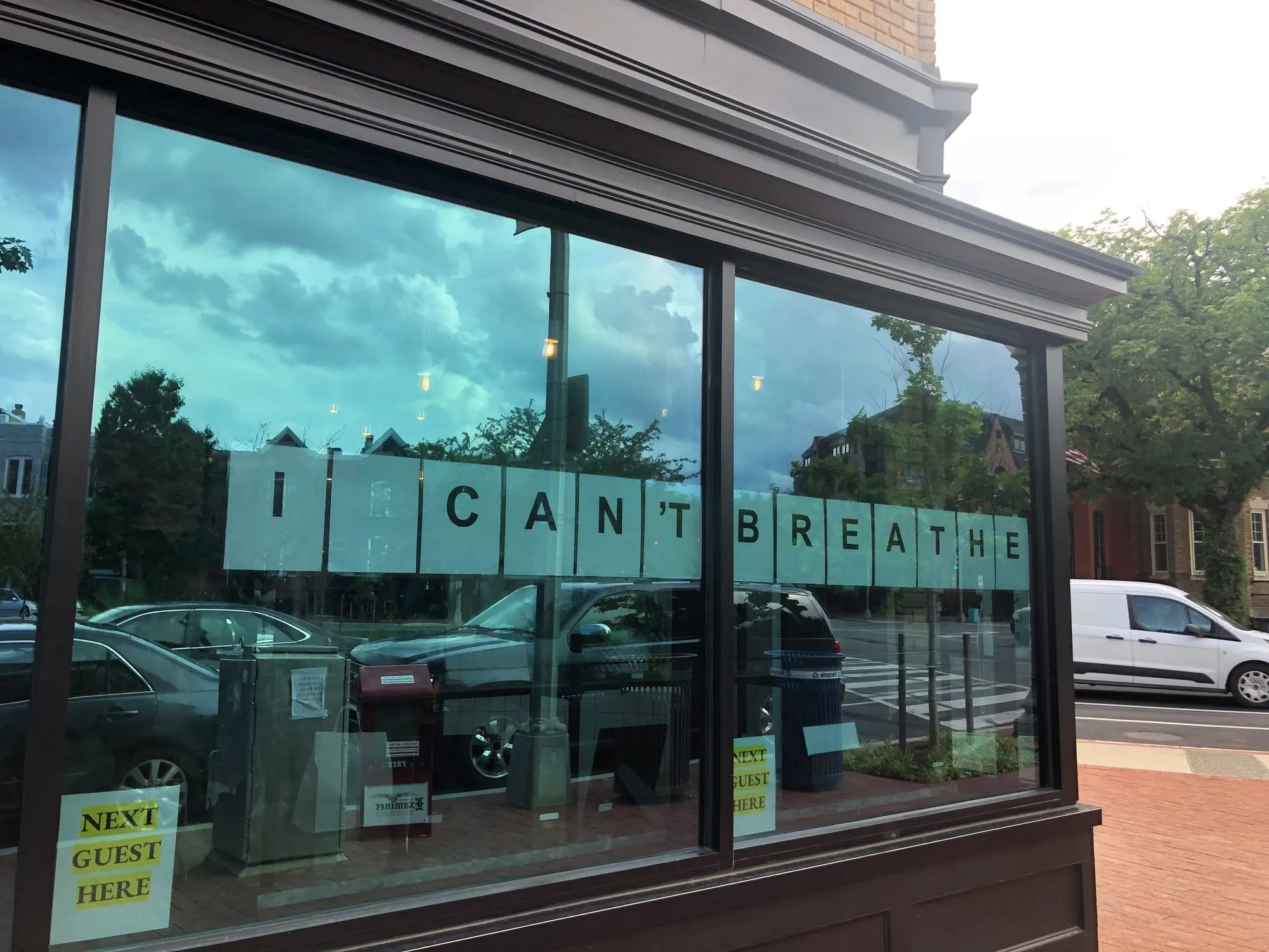 I can't breathe, lettered across a Washington, DC storefront window in 2020