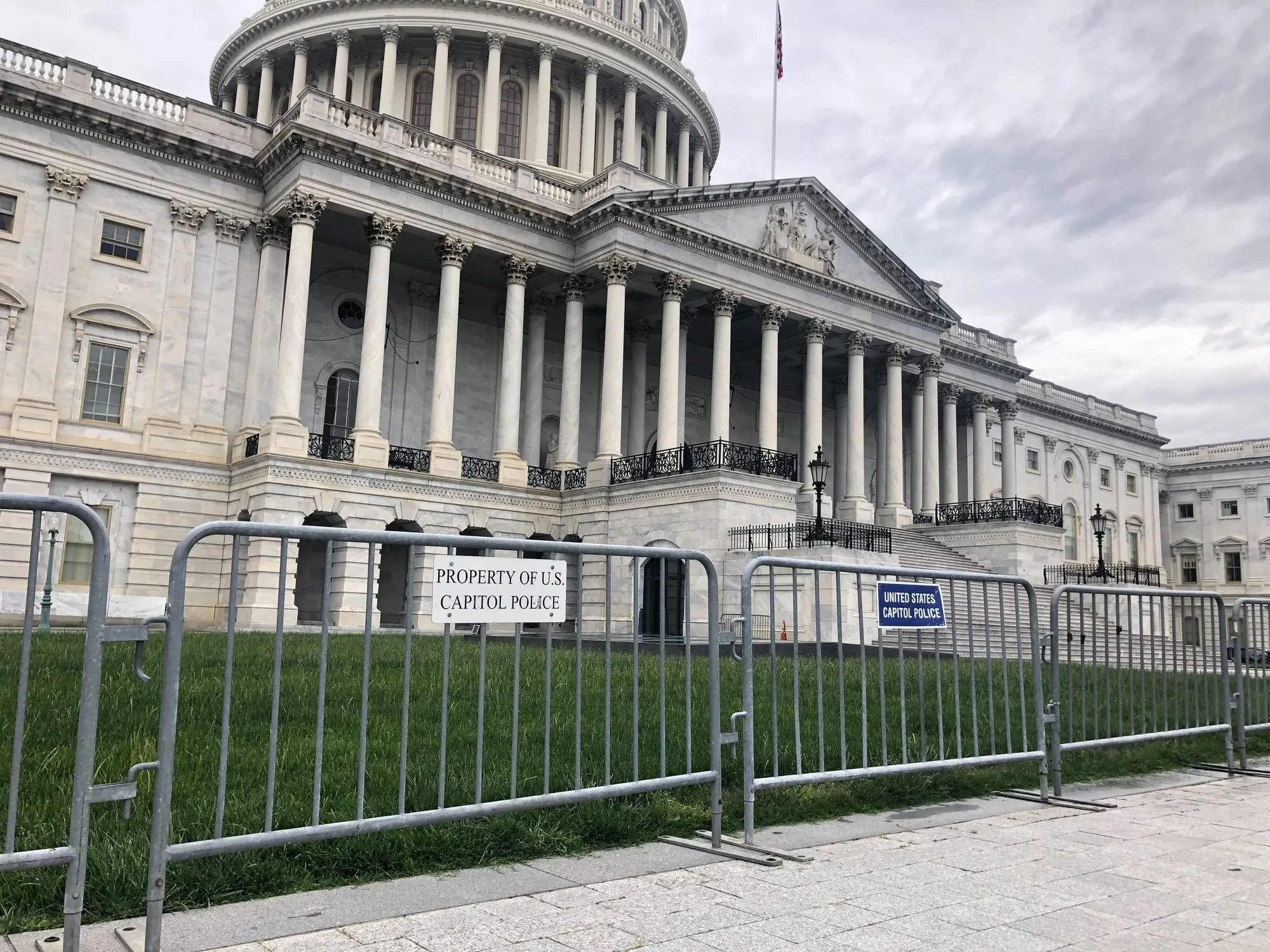 The US Capitol behind metal barricades